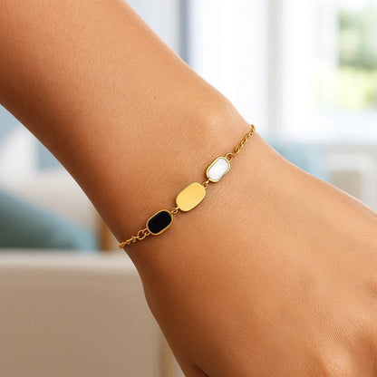 Nicholanti Collection 14k Yellow Gold Onyx & Mother-of-Pearl Inlay Links Bracelet - angled side view showing craftsmanship