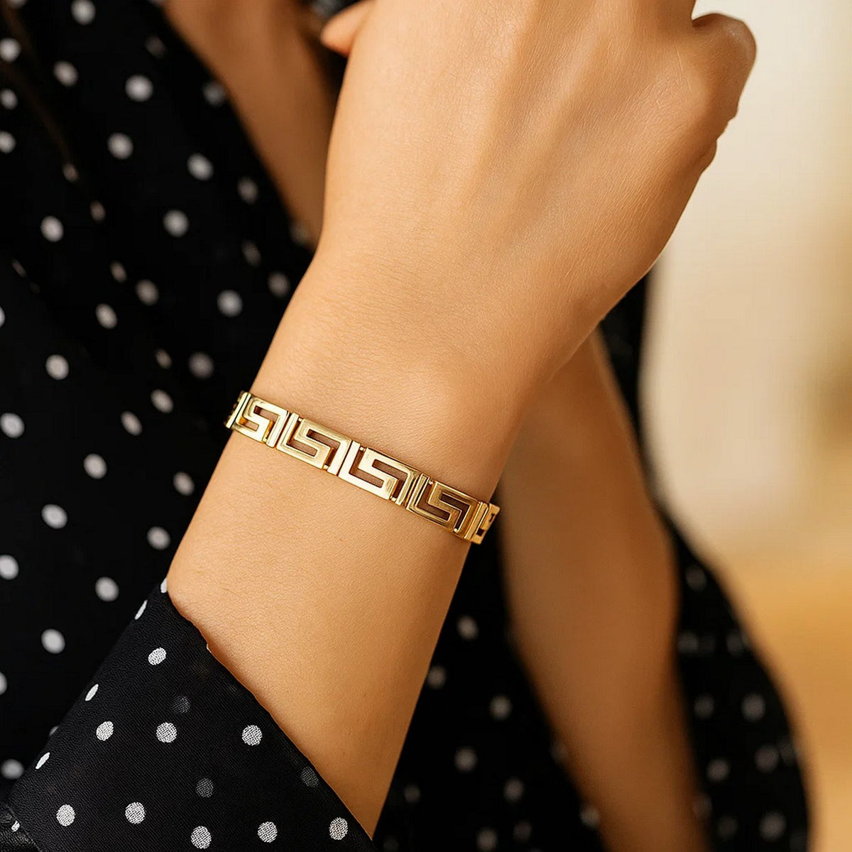 Nicholanti Collection 14k Yellow Gold Fancy Greek Key Motif Bracelet (6.35 mm) - scale view on wrist