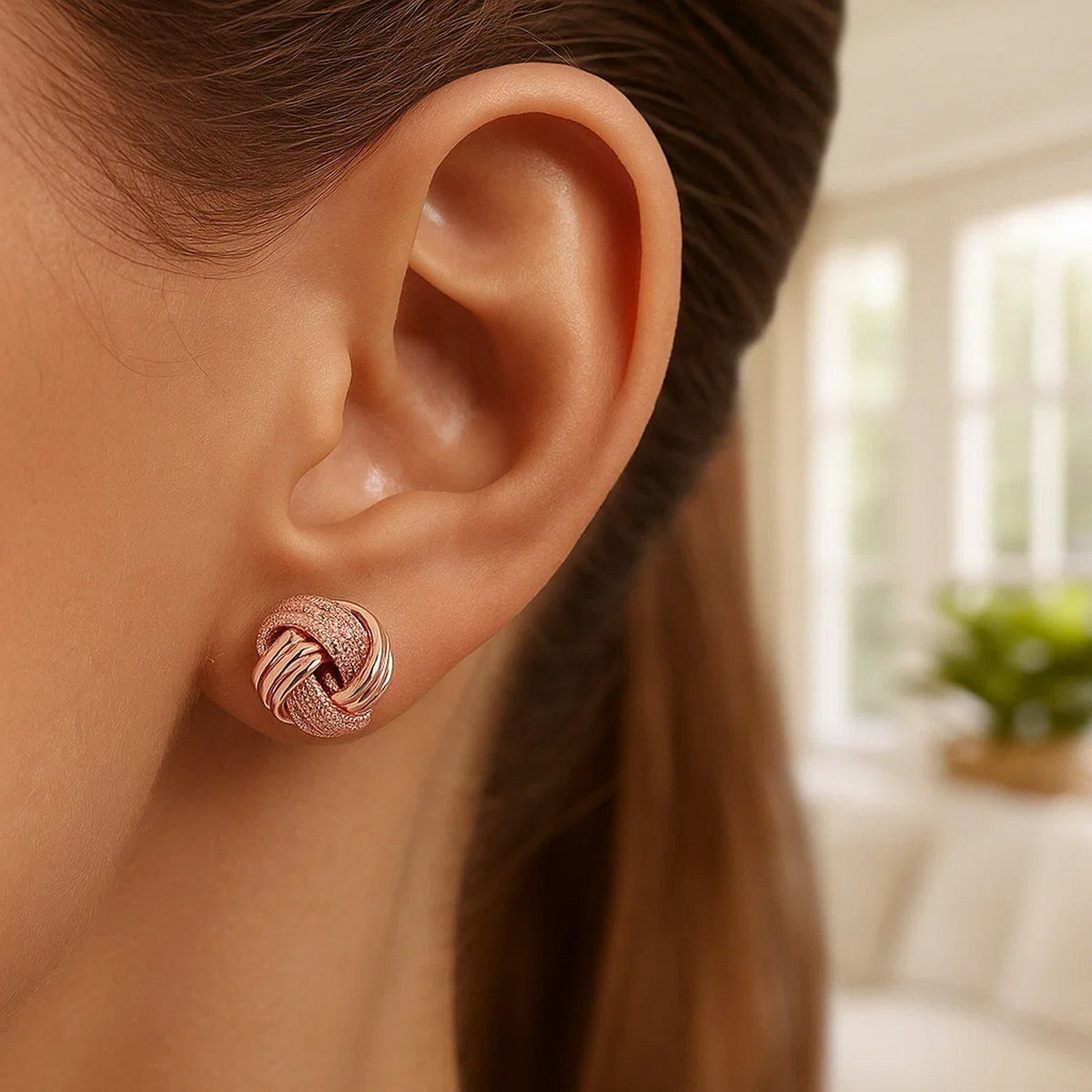 Nicholanti Collection 14k Rose Gold Unique Love Knot Beautifully Crafted Ridge Textured Earrings - worn by model side profile