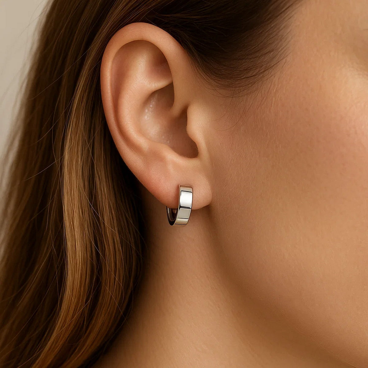 Nicholanti Collection 10k White Gold Snuggable Hoop Earrings - worn by model side profile