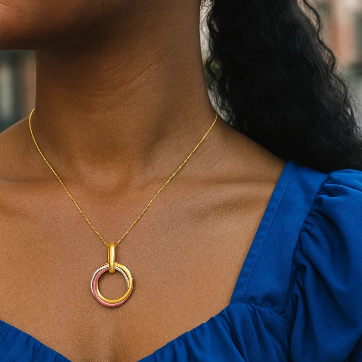 Nicholanti Collection 14k Tri-Color Gold Open Interlaced Ring Pendant - close-up detail showing texture